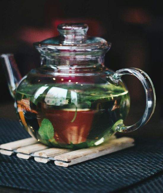 Close up of herbal tea brewing in a glass teapot